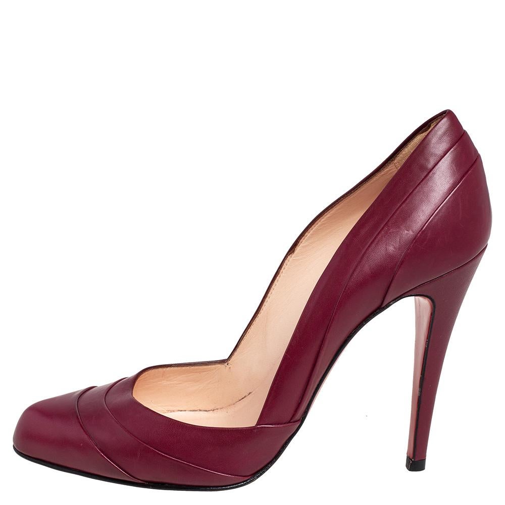 These Christian Louboutin pumps are a reflection of the label's immaculate artistry in shoemaking. Crafted from burgundy leather, they are adorned with a layered design and are raised on slender heels.

Includes: Original Dustbag