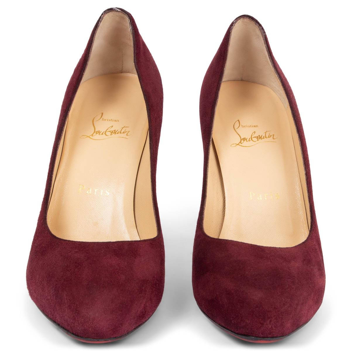100% authentic Christian Louboutin Simple 100 pumps in burgundy suede leather. The design features a hidden platform. Have been worn and show some soft wear to the left heel. Overall in excellent condition. Red rubber sole got added. Come with dust