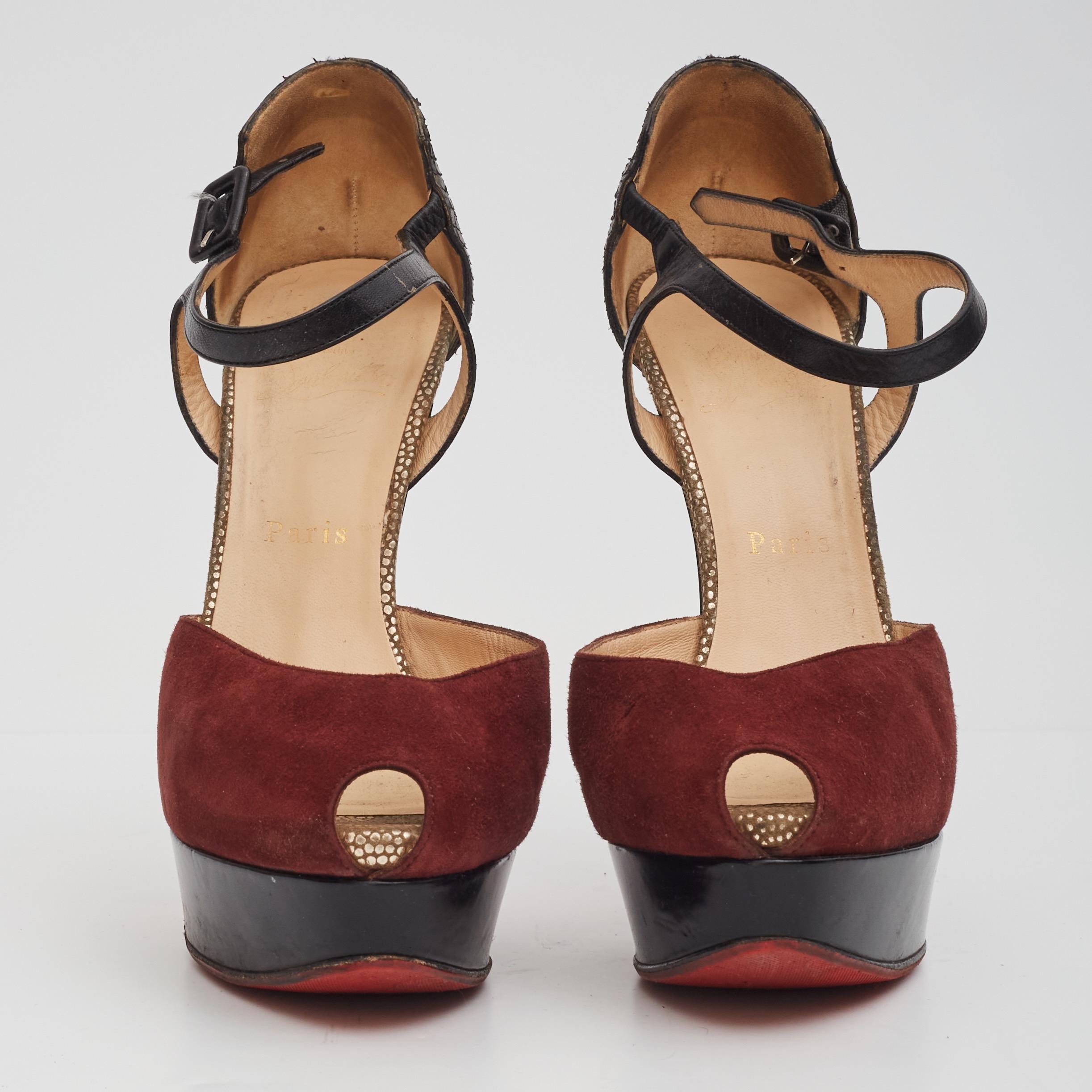Christian Louboutin platform heels are made with burgundy suede and brown snake. The heels features a peep toe, a 25mm (1inch) platform, 150mm (6inch) heels and an ankle strap for support.

Color/material: Burgundy suede and snake skin brown
Size: