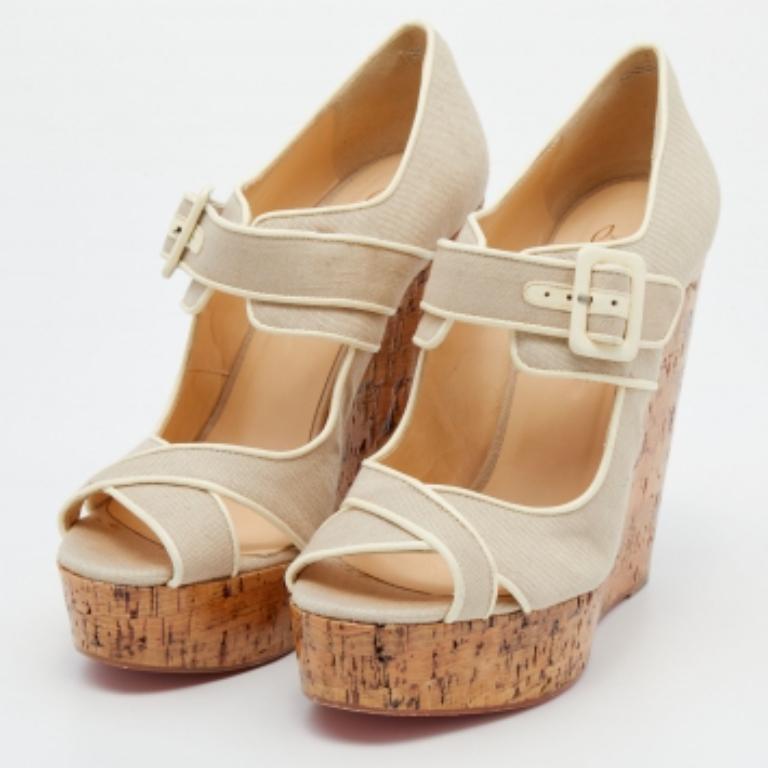 If you prefer something simple in design yet classy, then this pair of Christian Louboutin pumps is an ideal option for you. It displays cork-incorporated heels, an intercross strap on the vamps, and an ankle buckle closure. Created from canvas and