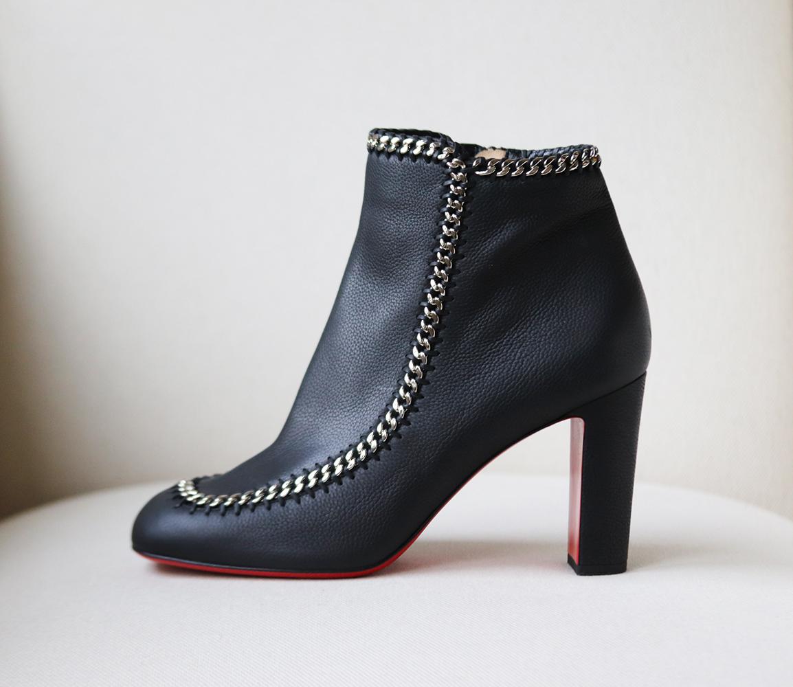 Christian Louboutin's pair feel darkly glamorous thanks to the glistening chain-trimming detail along the boot, they've been made in Italy from black leather and set on a sole lacquered in signature red.
Rubber eel measures approximately 85mm/ 3.5
