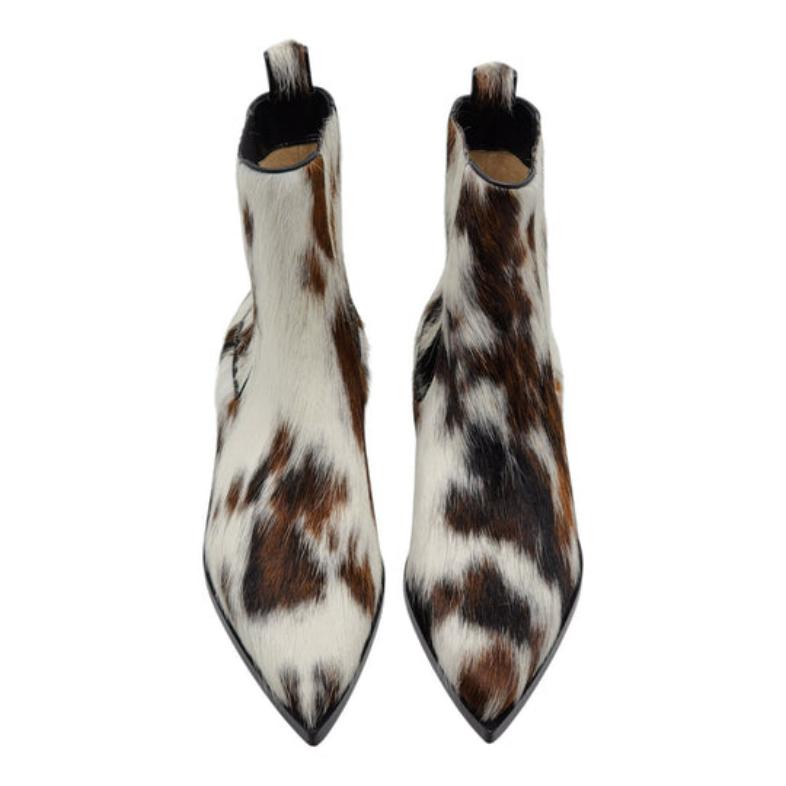 Christian Louboutin Cheliviss Low Boots - Hair-on Calf 'Meuh' in Brown and White.

Notes from Louboutin: Inspired by a Wild West aesthetic, the Cheliviss ankle boot takes its name from a famous singer. This Maison Christian Louboutin style is