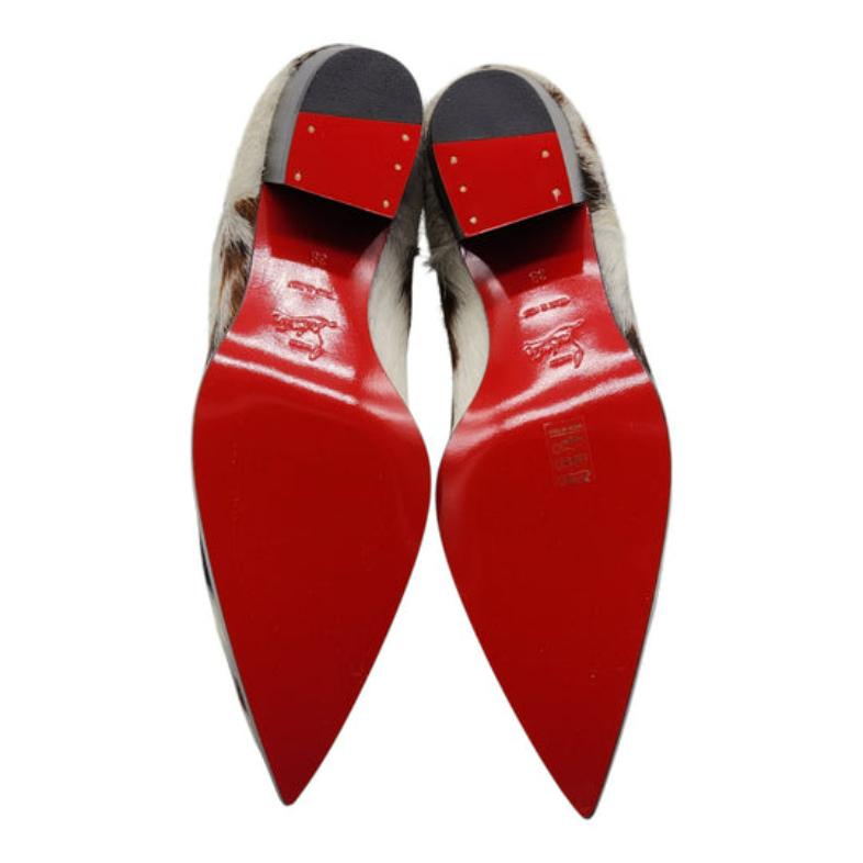 Black Christian Louboutin Cheliviss Low Boots - Hair-on Calf 'Meuh' in Brown and White For Sale