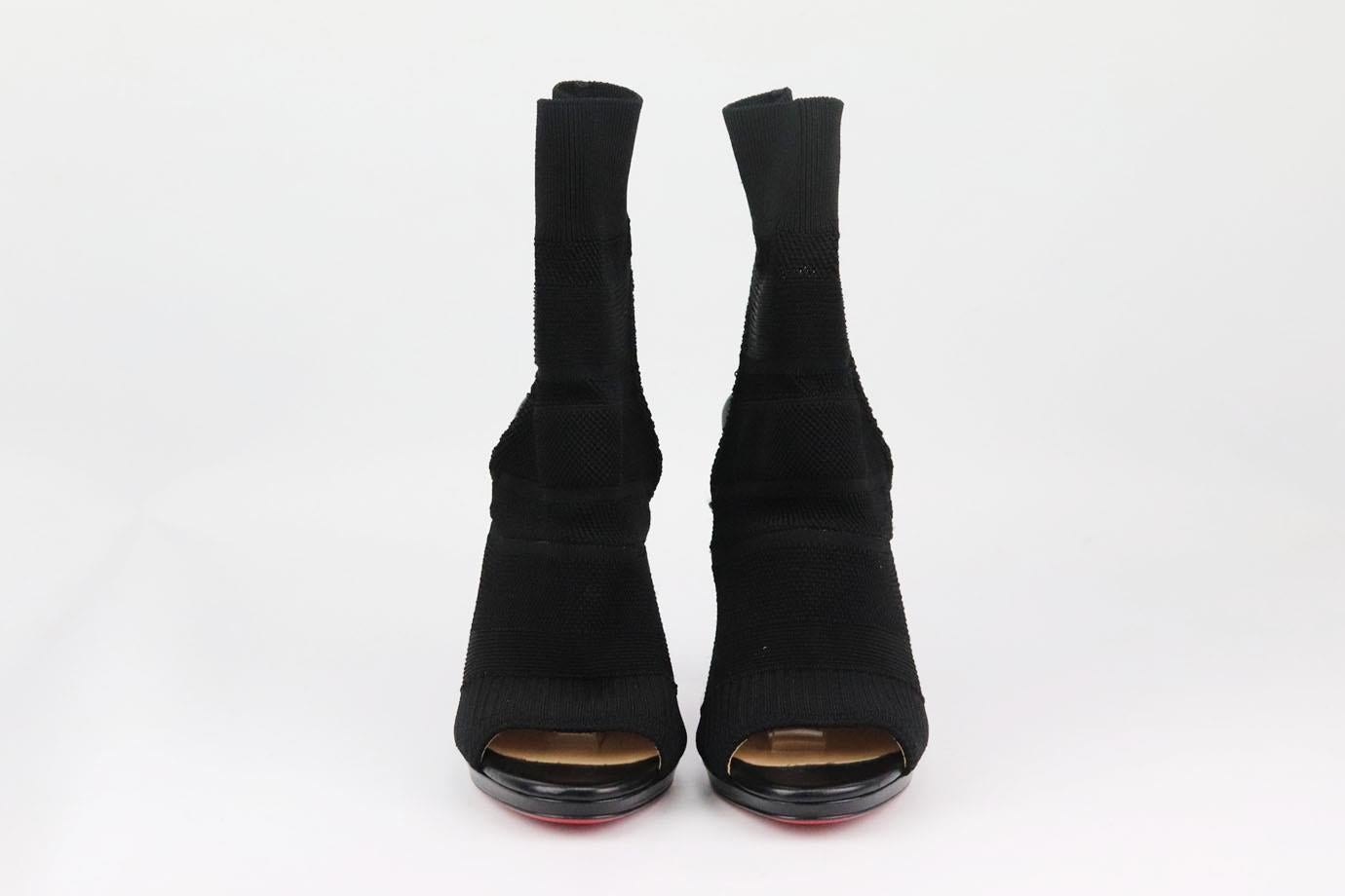 Christian Louboutin understands what it takes to make a woman's foot look amazing, and these stretch-knit 'Cheminene' boots are designed for a flattering sock-like fit, this peep-toe pair sits on a sky-high 120mm stiletto heel and has a cutout back.