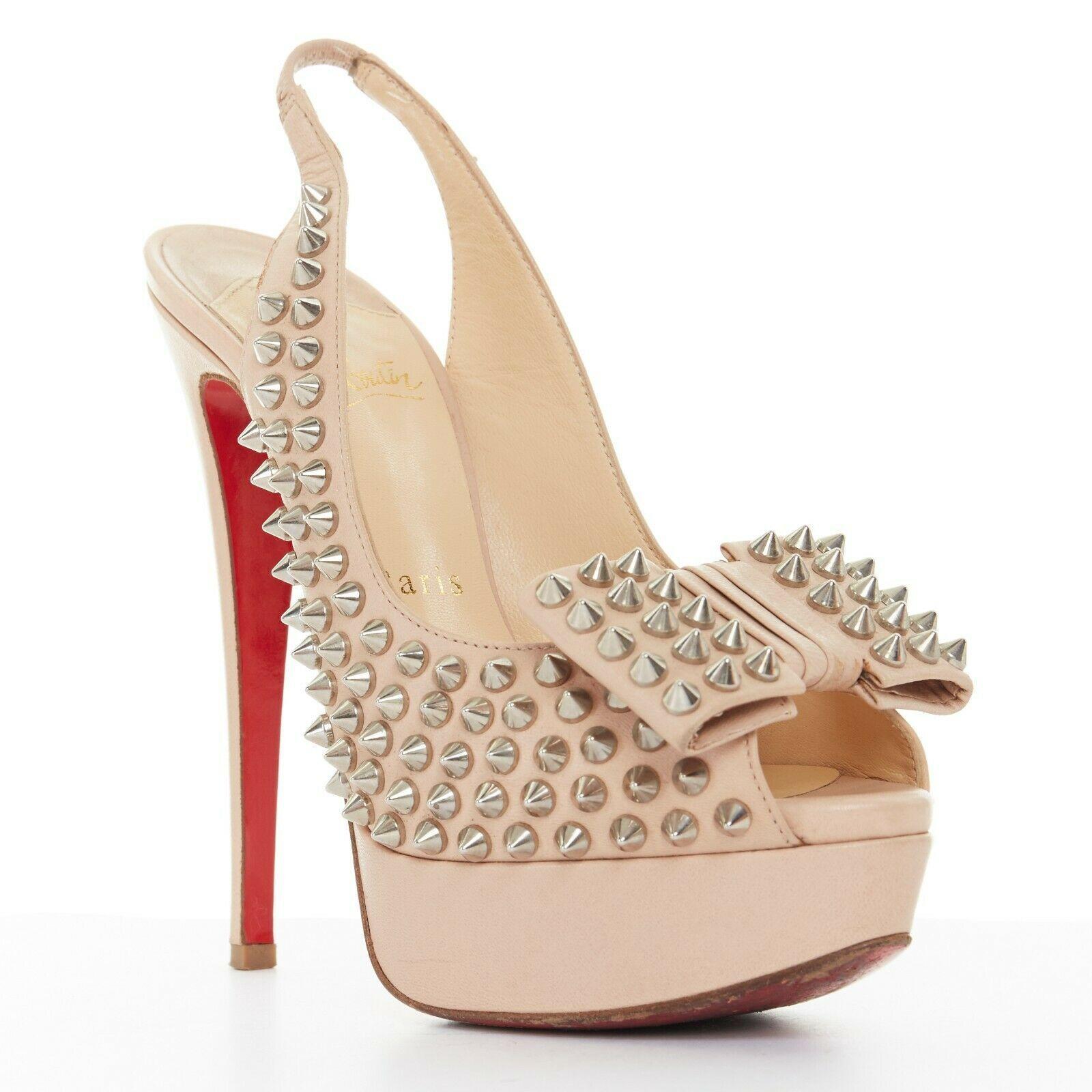 CHRISTIAN LOUBOUTIN Clou Noeud 150 nude spike stud bow peep toe platform EU36
CHRISTIAN LOUBOUTIN
Clou Noued 150. Nude leather upper. 
Silver-tone hardware. Spike stud all-over embellishment. Origami flat bow detail at toe. 
Peep toe. Platform sole.