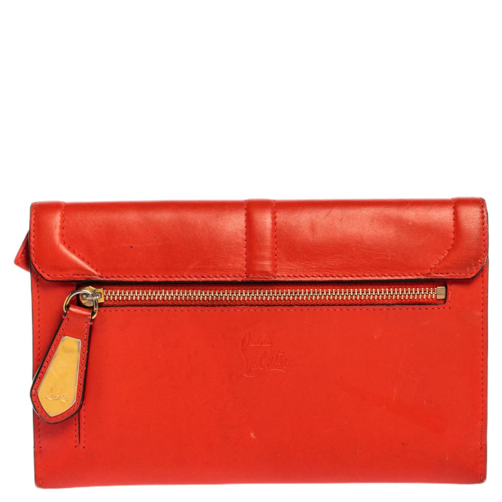 This Christian Louboutin Sweet Charity wallet is simply adorable. Made from soft leather, it’s accented with a sweet bow on the front flap. The snap button closure opens to a nylon-lined interior that features card slots. The back has a zipper