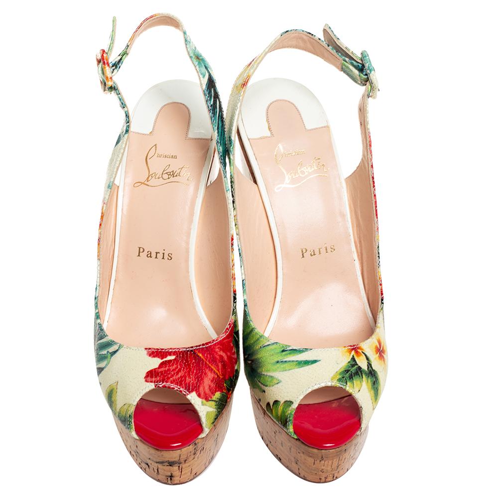 Christian Louboutin sandals feature a sturdy corked wedge heel and the signature red sole on the underside. Crafted in multicolored leather, these open-toe sandals feature a buckle-fastening slingback strap. Wear yours with pastel dresses for summer