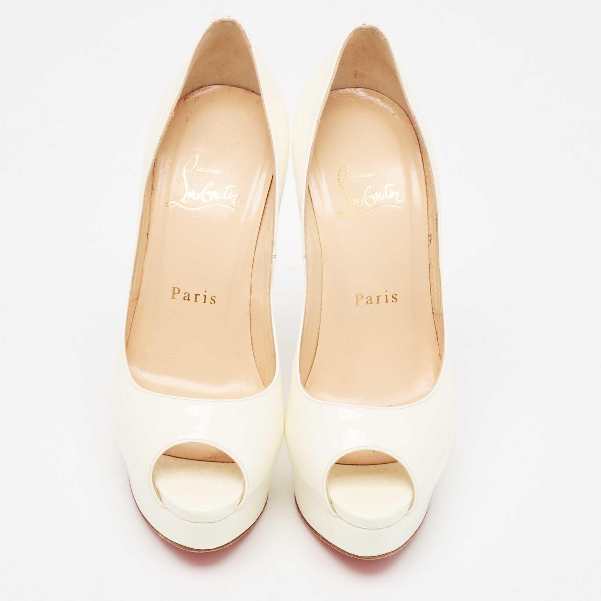 Stand out from the crowd with this luxurious pair of Louboutins that exude high fashion with class. Crafted from patent leather, this is a creation from their Lady Peep collection. It features a cream shade with peep toes and an architectural shape.