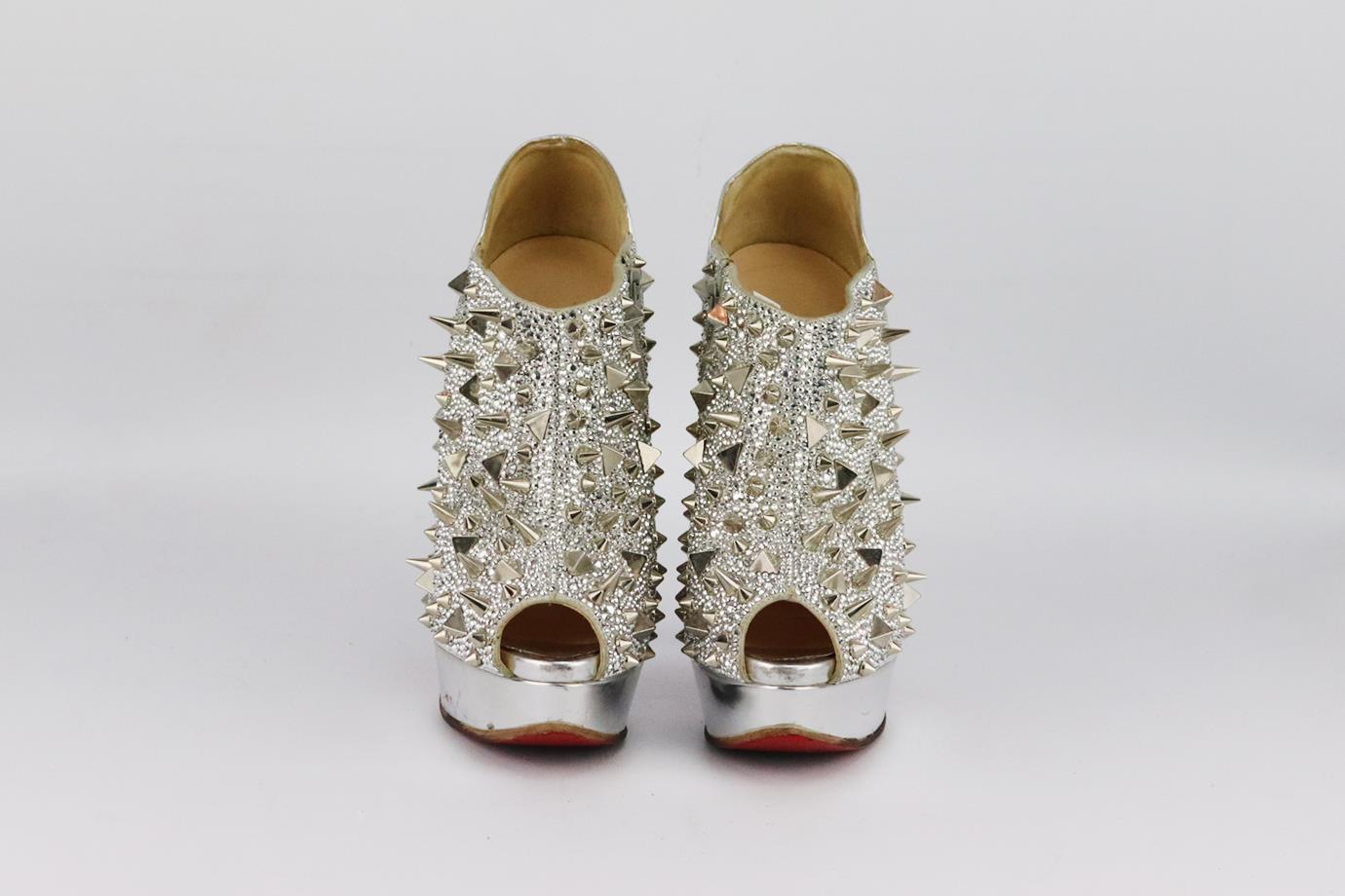 Christian Louboutin crystal spiked leather platform ankle boots. Made from metallic crystal embellishment with spikes in a peep toe silhouette and set on the brand’s iconic red sole. Silver. Zip fastening at side. Does not come with box or dustbag.