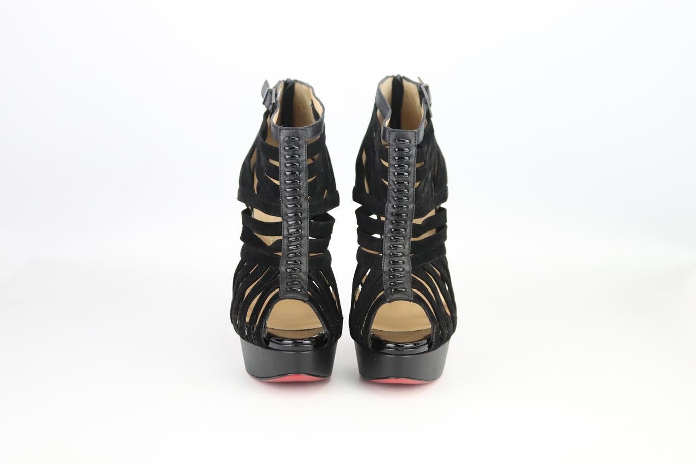 Christian Louboutin cutout suede and leather platform sandals. Made from black patent leather and suede with cutout detail and set on the brand’s iconic red sole. Black. Zip fastening at back. Does not come with box or dustbag. Size: EU 38 (UK 5, US