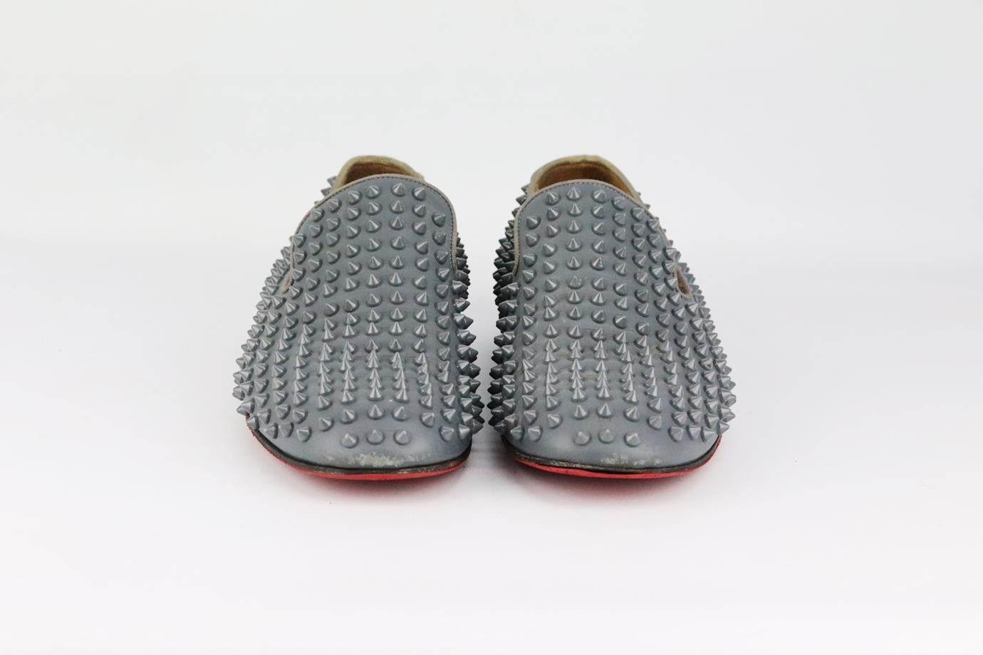 Christian Louboutin Dandelion spiked leather loafers. Made from grey matte leather with glossy spikes throughout and set on the brand’s iconic red sole. Grey. Slip on. Does not come with box or dustbag. Size: EU 43.5 (UK 9.5, US 10.5). Insole: 11.2