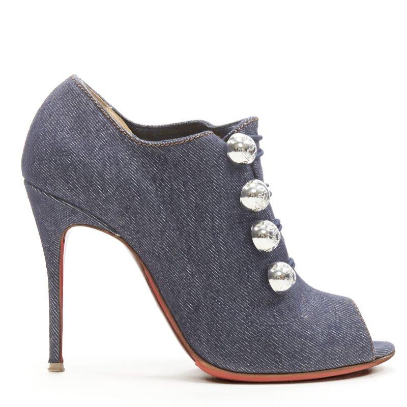 CHRISTIAN LOUBOUTIN dark denim silver military button peep toe bootie EU37
Reference: ANWU/A00186
Brand: Christian Louboutin
Material: Denim
Color: Blue, Silver
Pattern: Solid
Closure: Stretchy
Lining:  Leather
Extra Details: Dark indigo denim