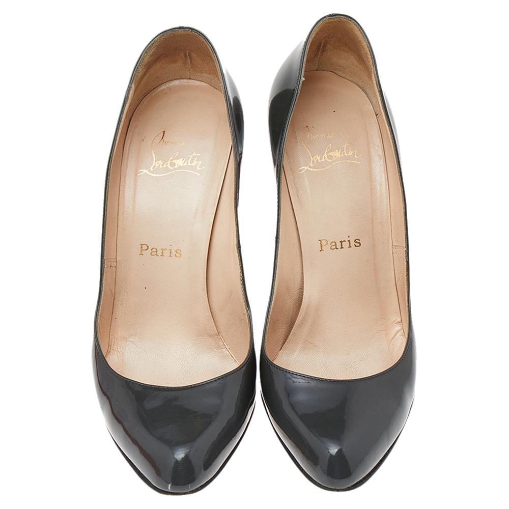 Add a special addition to your shoe collection with these Christian Louboutin pumps. Crafted from patent leather, these dark grey pumps carry a mesmerizing shape with covered toes and 11 cm heels.

Includes: Original Dustbag
