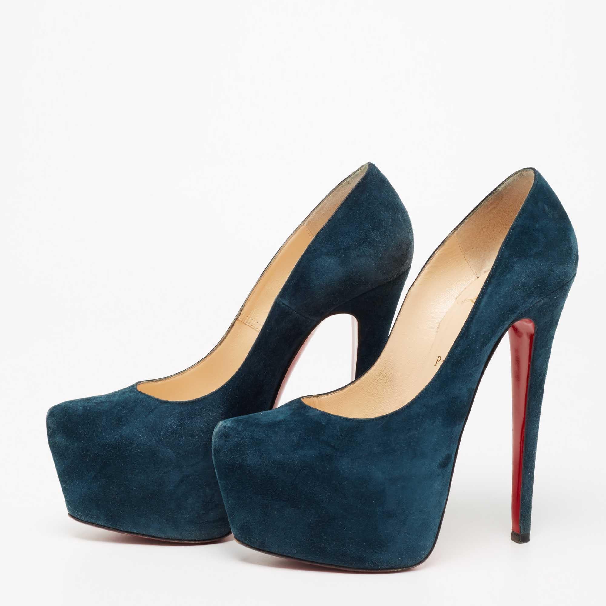 Take every step with elegance and style in these Daffodile pumps from the House of Christian Louboutin. They are crafted meticulously using dark-teal suede. They showcase thick platforms, towering heels, and a slip-on feature. These beautiful CL