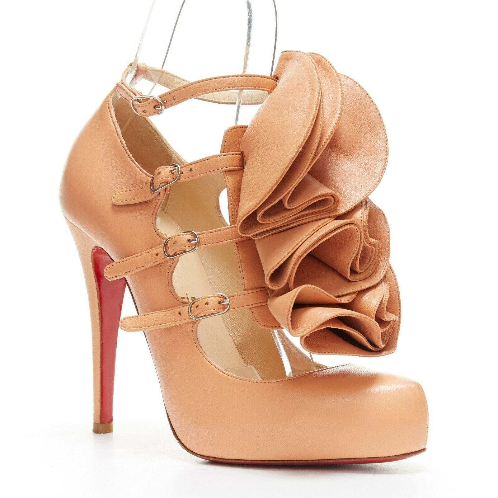 CHRISTIAN LOUBOUTIN Dillian 120 nude leather ruffle multi strap platform EU37.5
CHRISTIAN LOUBOUTIN
Dillon 120. 
Nude leather upper. Floral ruffle patch at front (removable). Multi-strap. 
Silver-tone buckle closure. Ankle strap. Covered heel. Slim