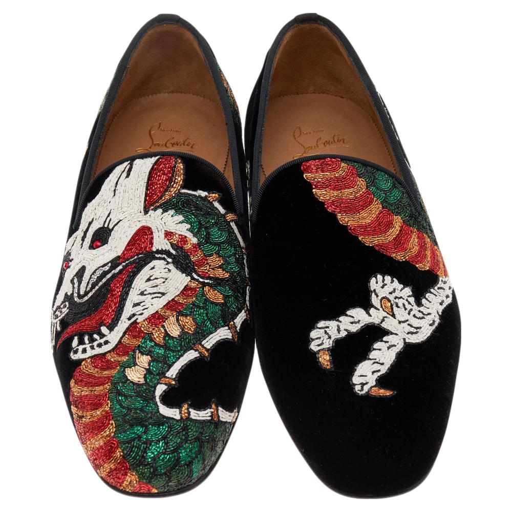 Strike a bold finish to your party outfit wearing these stunning Christian Louboutin loafers. Crafted from velvet, the exterior is overlaid with dragon motifs all over. Style them with trousers and a printed shirt.

Includes: Original Dustbag,