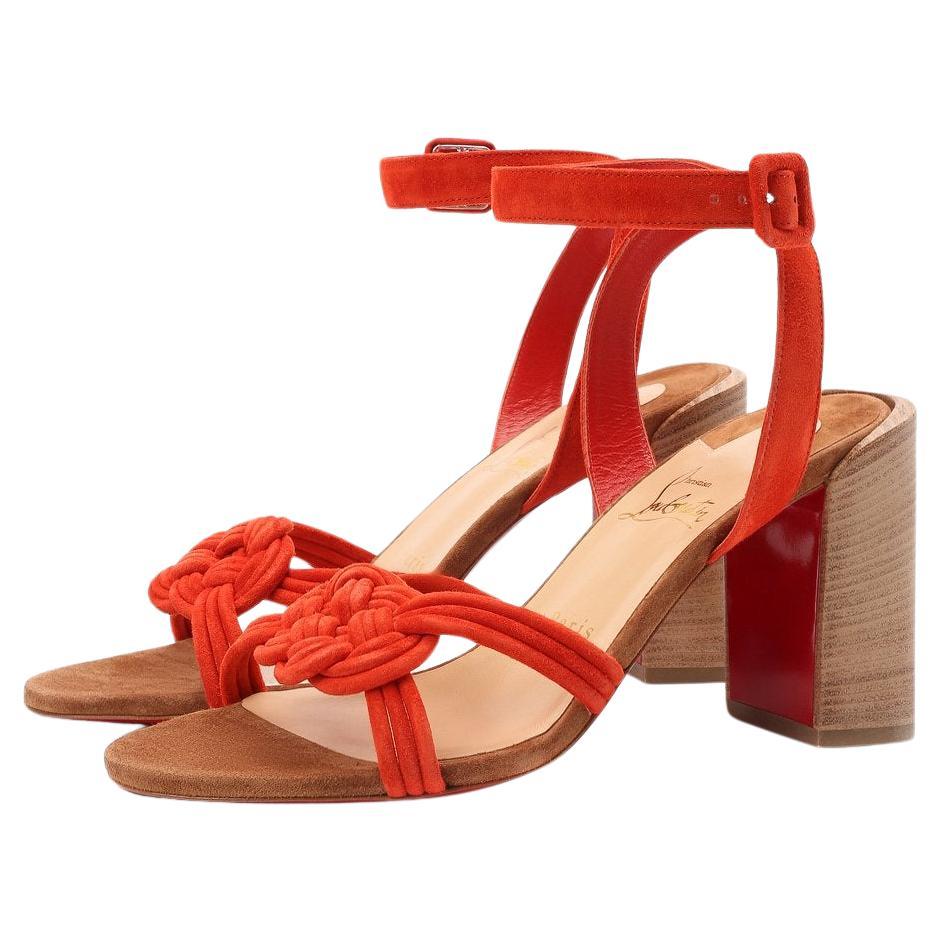 Christian Louboutin's 'Ella' sandals have been made in Italy from supple red suede that's artfully interwoven at the toes. They're set on sturdy block heels and have supportive buckle-fastening ankle straps.