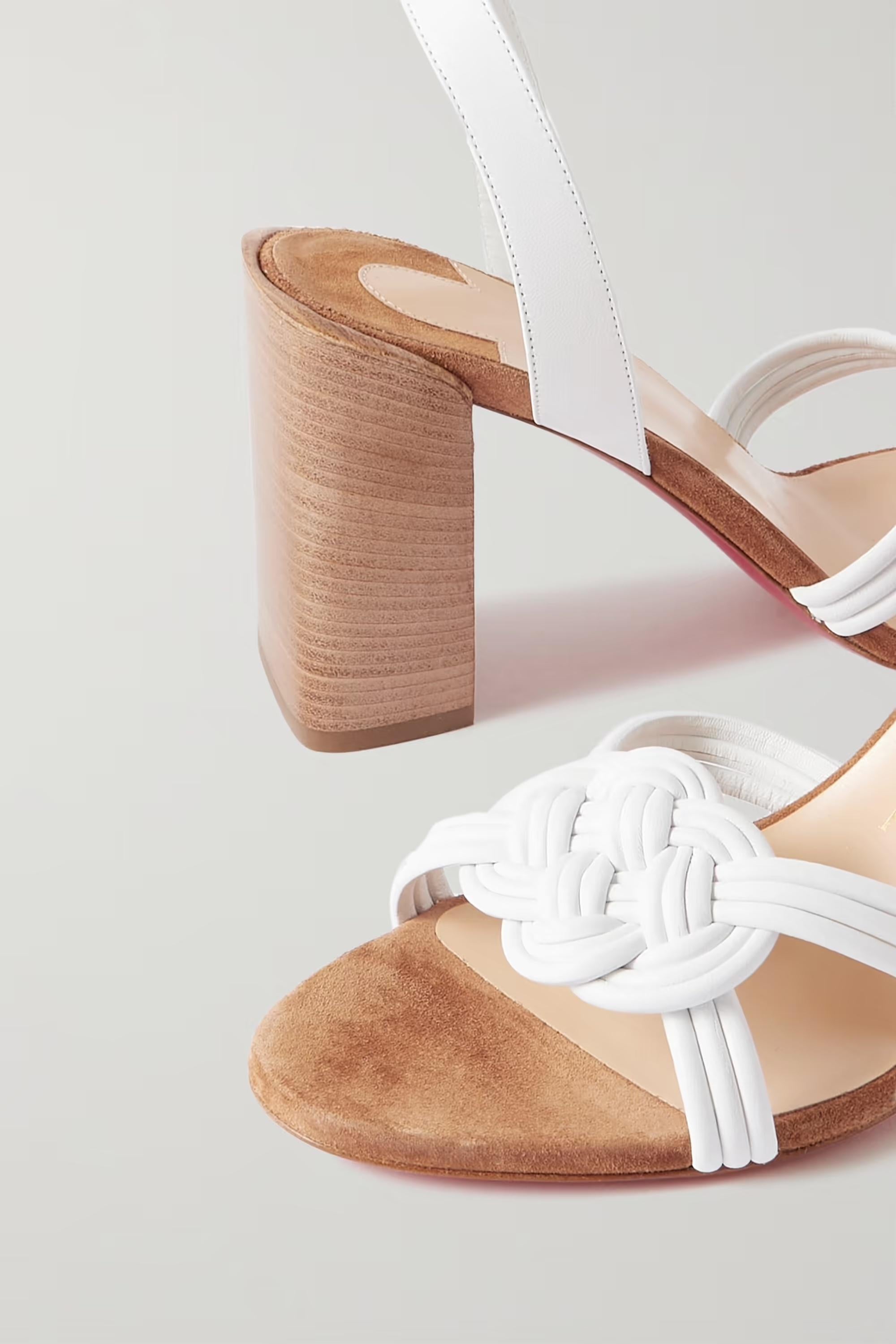 Christian Louboutin's 'Ella' sandals have been made in Italy from supple white leather that's artfully interwoven at the toes. They're set on sturdy block heels and have supportive buckle-fastening ankle straps. Brand new, never worn. Comes in