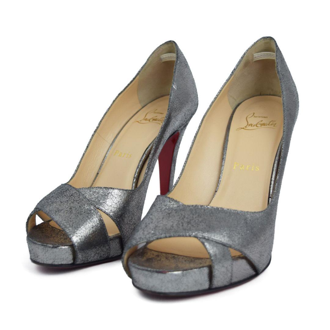 Christian Louboutin Dark Silver Platform peep-toe heels.

Material: Leather
Size: EU 37.5
Heel length: 10cm
Platform: 2cm
Overall Condition: Good
Interior Condition: Signs Of Use
Exterior Condition: Light scuffing on the metallic finish.