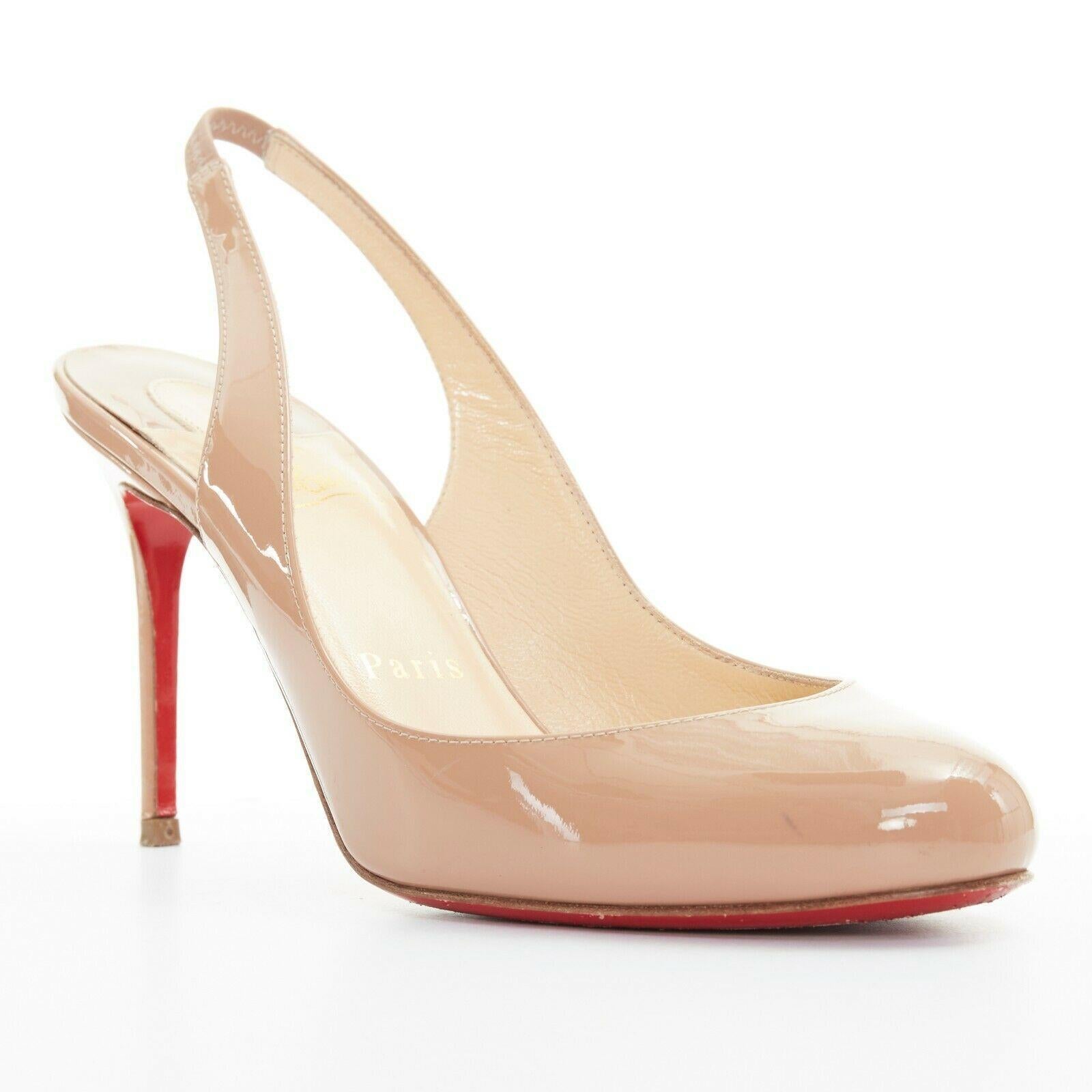 CHRISTIAN LOUBOUTIN Fifi Sling 85 nude patent round toe slingback heel EU36
CHRISTIAN LOUBOUTIN
Fifi Sling 85. 
Nude patent leather upper. 
Round toe. 
Sling back. 
Tonal stitching. 
Padded tan leather lining. 
Signature Louboutin red lacquared