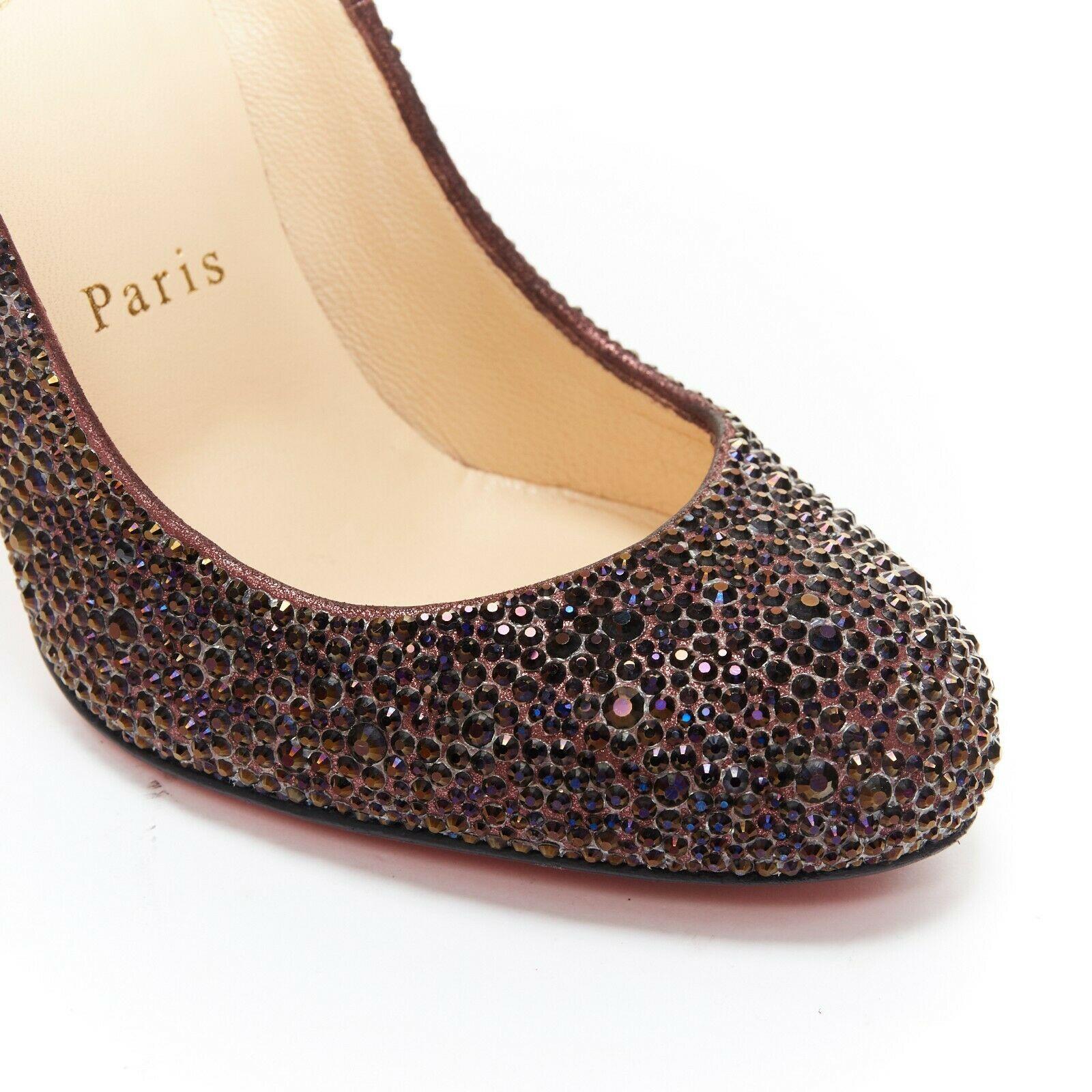 CHRISTIAN LOUBOUTIN Fifille 100 purple crystals embellished high heel pumps EU35
CHRISTIAN LOUBOUTIN
Style Fifille 100. Embellished with dark purple crystals. Round toe front. High heel pumps. 
Signature Christian Louboutin red bottom sole. Tan