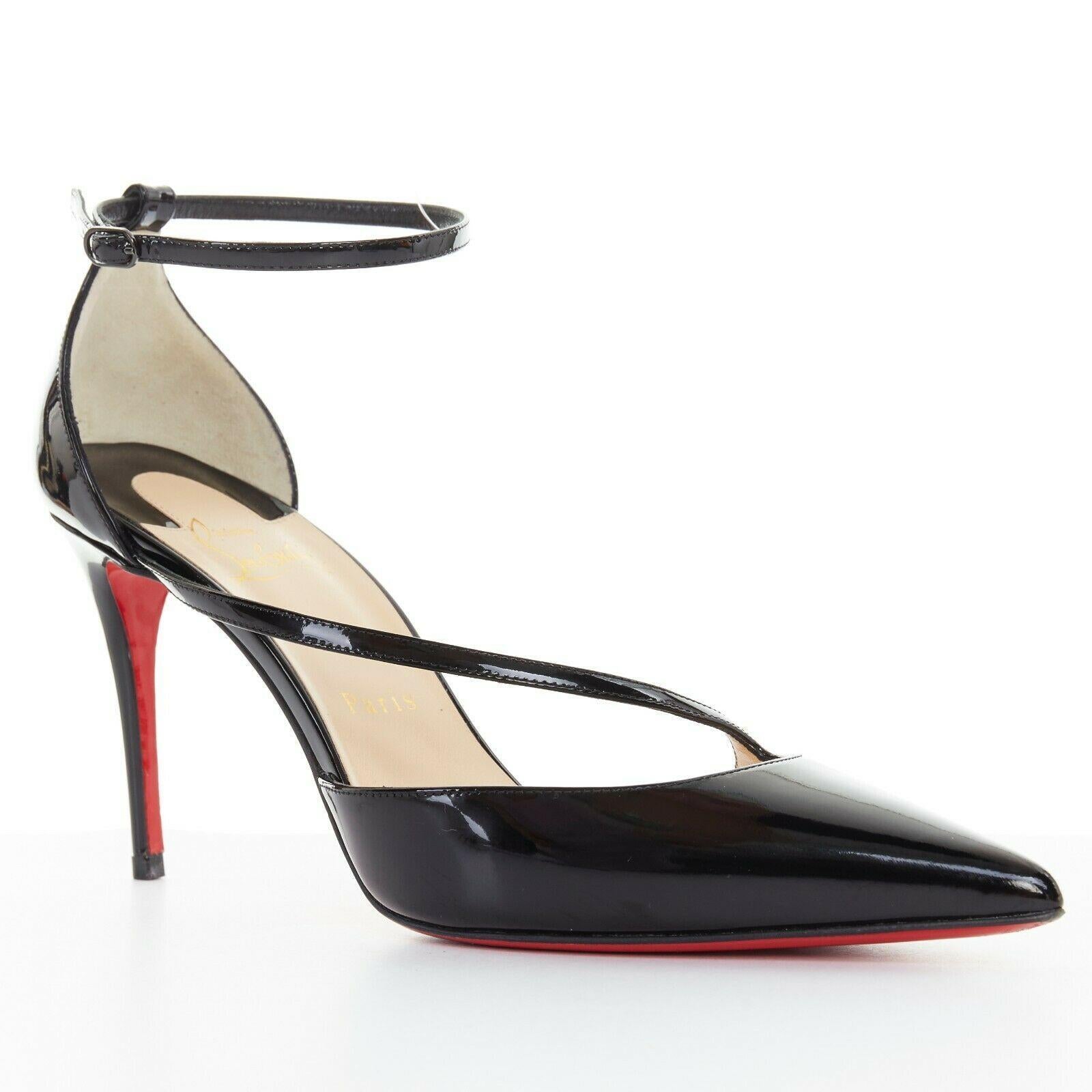 CHRISTIAN LOUBOUTIN Fliketta 85 black patent cross strap dorsay pump EU38
CHRISTIAN LOUBOUTIN
Fliketta 85. Black patent leather. Dorsay silhouette. 
Cross over strap at vamp. Covered heel. Ankle strap. Silver-tone metal buckle. 
Pointed toe.Stiletto