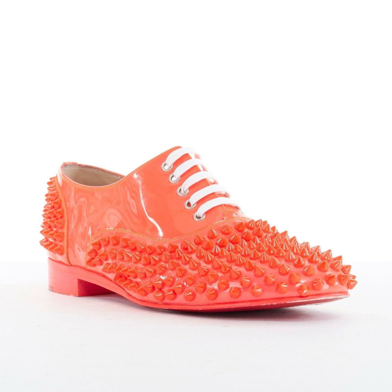 CHRISTIAN LOUBOUTIN Freddy electric pink neon spike studded laced flats EU37.5
CHRISTIAN LOUBOUTIN
Electric neon pink patent leather. Tonal spike stud embellished upper. 
Rounded toe. White flat laced front. Stacked wooden heel. 
Eletric pink
