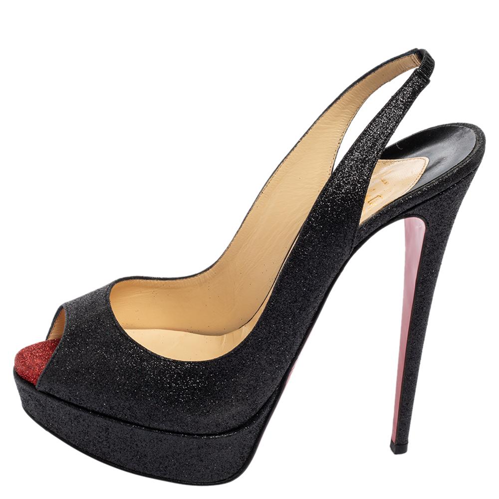 Stand out from the crowd with this gorgeous pair of Louboutins that exude high fashion with elegance! Crafted from glitter, this is a creation from their Lady Peep collection. The sandals feature a classic black shade with peep toes and a shimmering