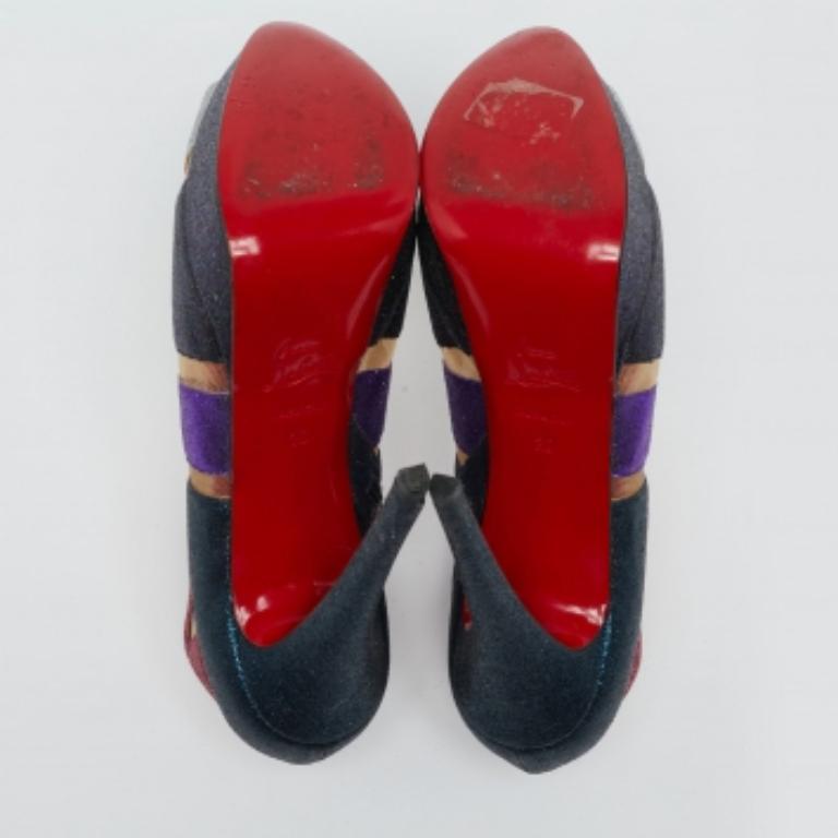 Take every step with confidence and panache in these stunning booties from the House of Christian Louboutin. They are styled using multicolored mesh and glitter on the exterior. They feature peep-toes, platforms, and tall 14.5 cm heels. These