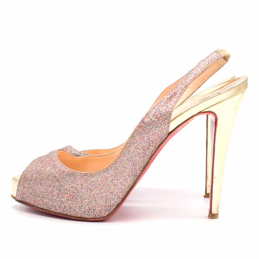 Christian Louboutin glitter numero prive peep toe pumps. 
Made in France. 

Features stylish peep toe and slingback. 
Includes 1/2 inch platform and a four 1/2 inch stiletto. 

Fabric: multi- coloured glitter/gold metallic leather. 

Please note,