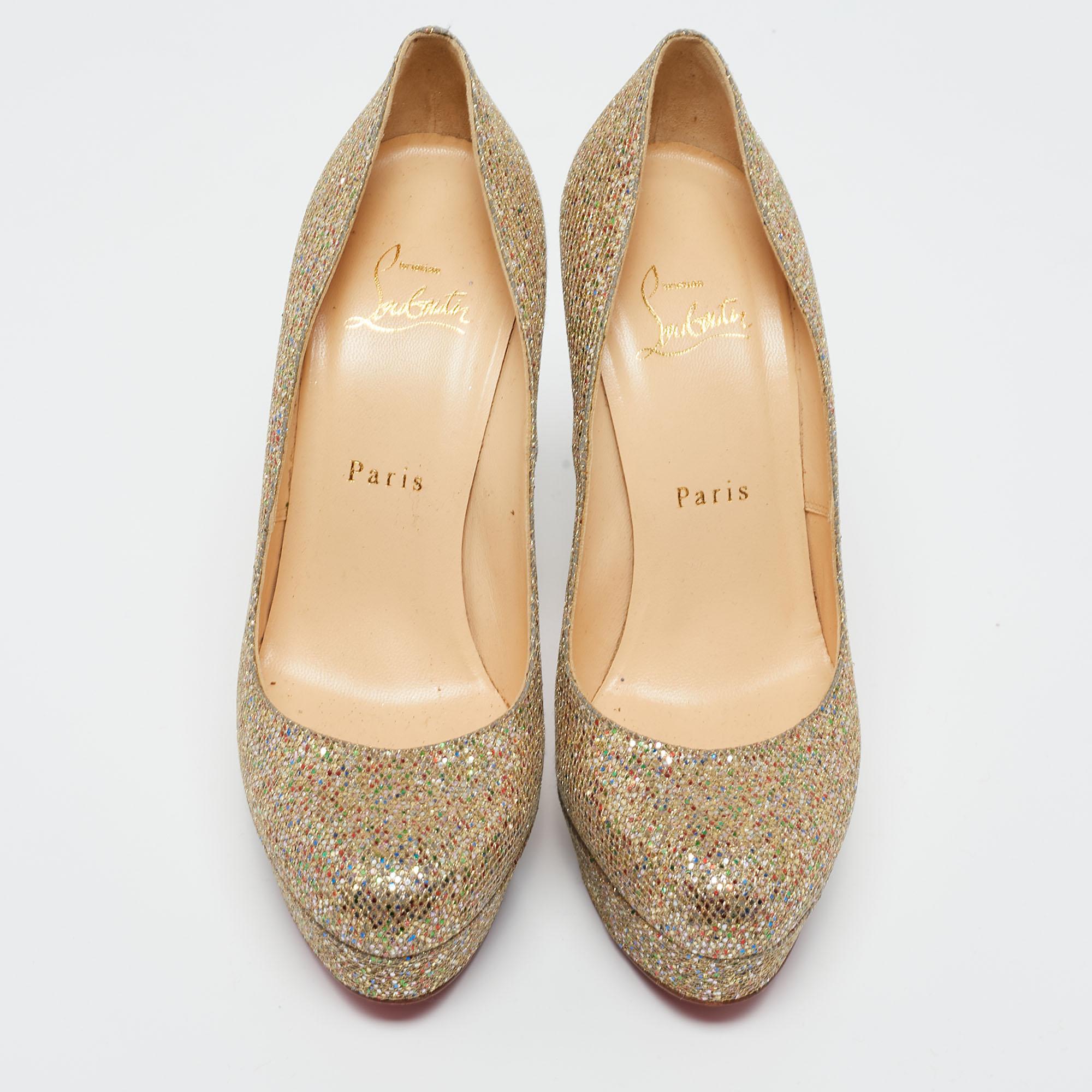 Feel glamorous every time you slip into this glitzy pair by Christian Louboutin. Covered in gold glitter and balanced on platforms and 12.5 cm heels, these pumps will be a winner with all your well-tailored outfits. They are finished with the