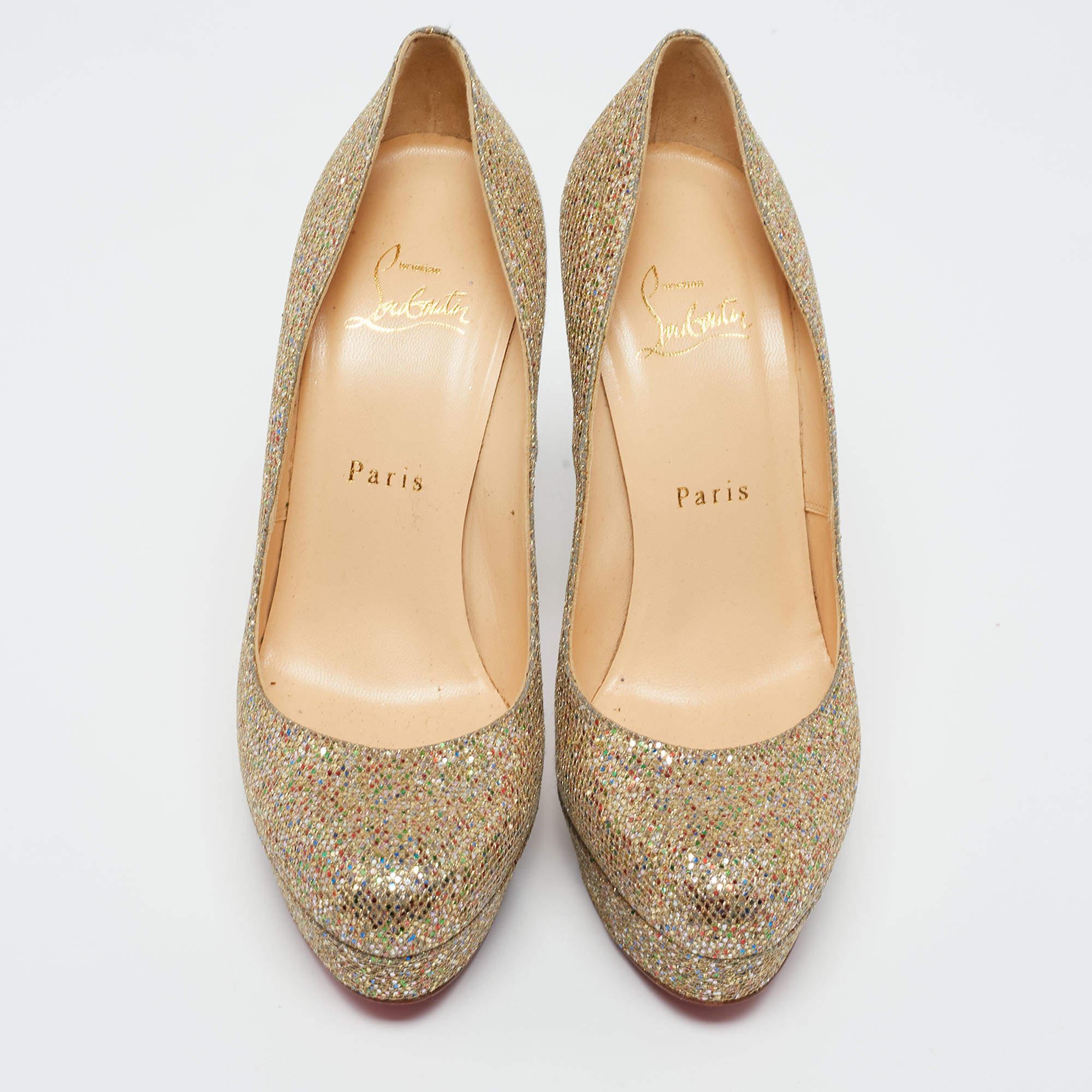 Feel glamorous every time you slip into this glitzy pair by Christian Louboutin. Covered in gold glitter and balanced on platforms and 12.5 cm heels, these pumps will be a winner with all your well-tailored outfits. They are finished with the