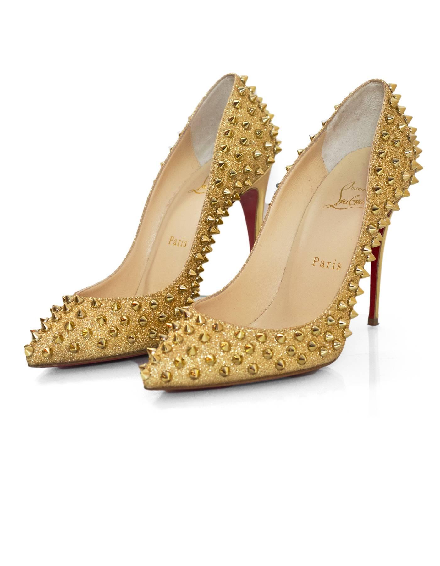 Christian Louboutin Gold Glitter Follies Spikes 100 Pumps Sz 38

Made In: Italy
Color: Gold
Materials: Glitter, metal
Closure/Opening: Slide on
Sole Stamp: Christian Louboutin Made in Italy 38
Retail Price: $1,295
Overall Condition: Excellent
