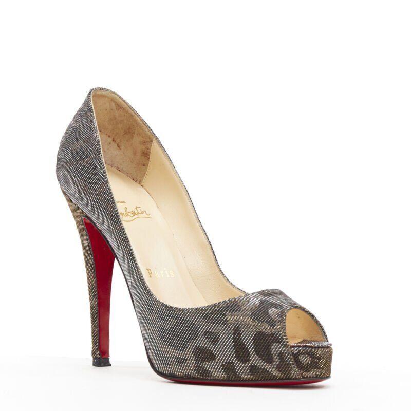 CHRISTIAN LOUBOUTIN gold lurex metallic leopard print peep toe platform EU36.5
Reference: TGAS/A05358
Brand: Christian Louboutin
Model: Peep platform
Material: Fabric
Color: Gold
Pattern: Leopard
Made in: Italy

CONDITION:
Condition: Very good, this