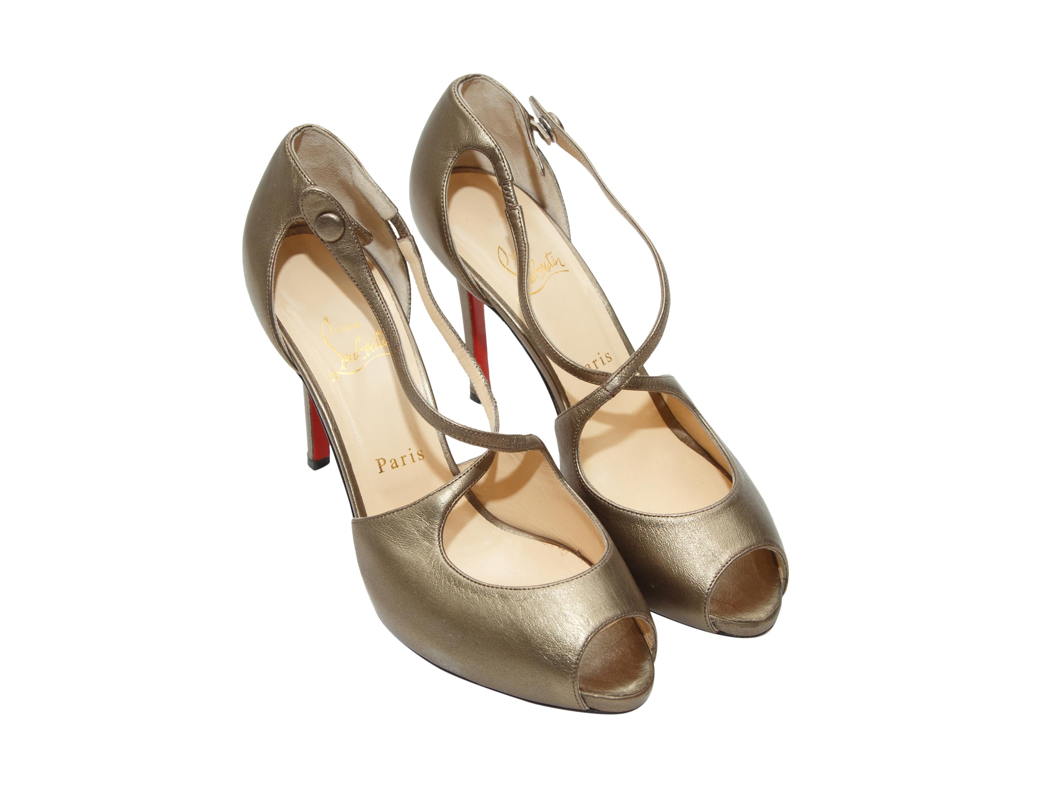 Product details: Gold metallic peep-toe pumps by Christian Louboutin. Crossover straps. Covered heels. Designer size 39. 4