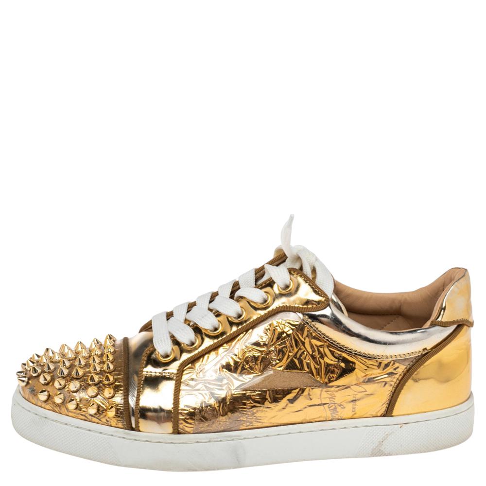 We see the signature spike details of Christian Louboutin well-translated on these sneakers. They are crafted from leather and PVC with spikes in gold-tone decorated on the cap toes. Lace-ups and leather insoles complete them.