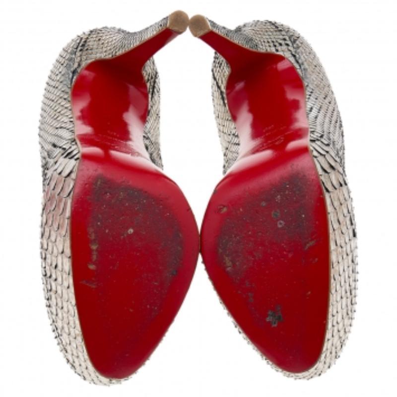 A classic to add to one's shoe collection is this pair. These Christian Louboutin beauties are covered in python leather and styled with platforms, 12.5 cm heels, and signature red soles. Add these glamorous pumps to your closet today.