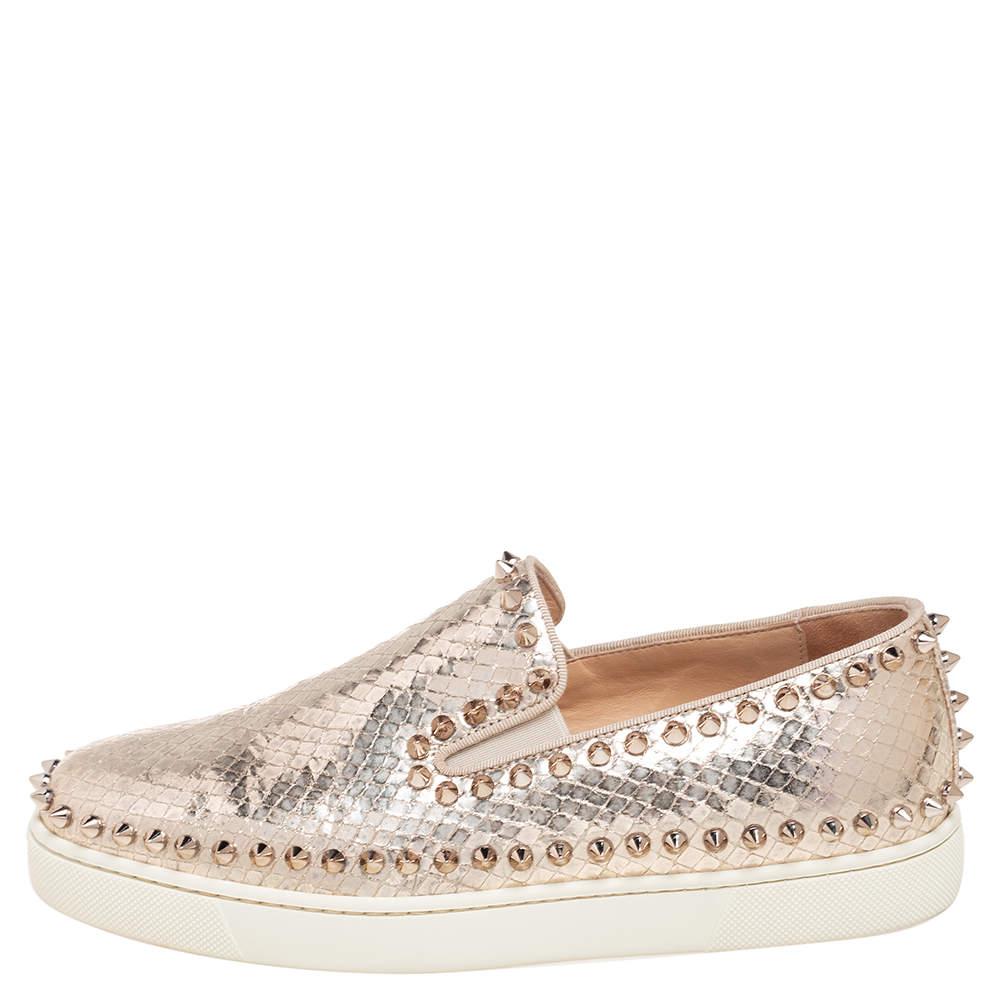 Add a unique style statement to your look with these eye-catching and fashionable Christian Louboutin slip-on sneakers. Constructed in gold python-embossed leather exuding a very neat finish, these shoes feature a chunky rubber sole in contrasting