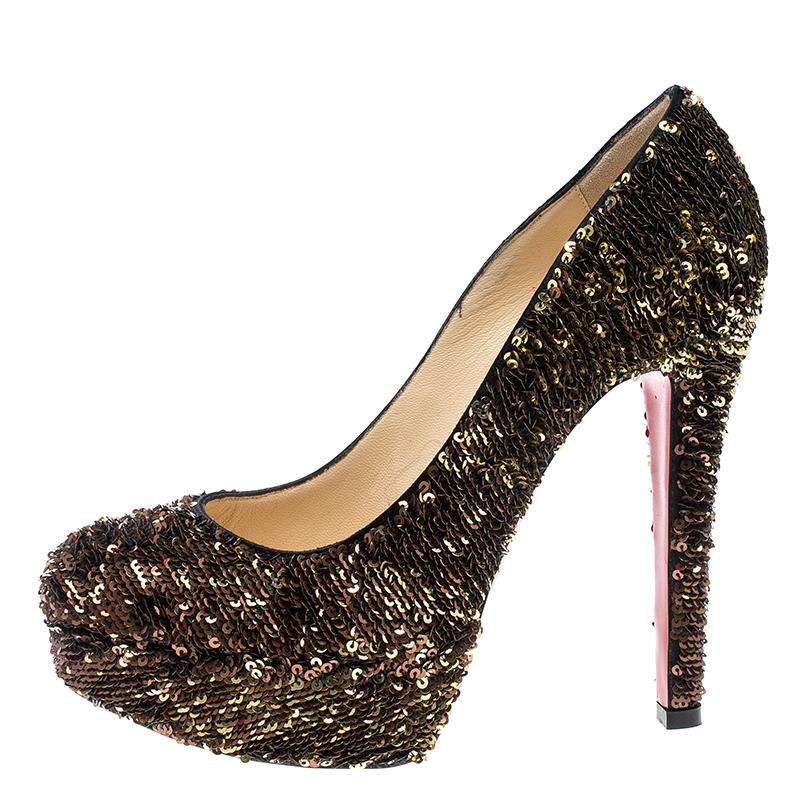 Every shoe collection needs a pair of pumps as enchanting as this one. These Christian Louboutin beauties are covered in sequins and styled with platforms, 12.5 cm heels, and the signature red soles. Add these pumps to your closet today and flaunt