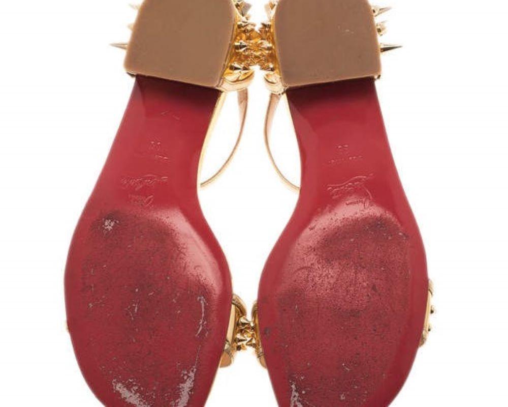 Give your outfit a touch of fierce with this pair of Christian Louboutin sandals. Made from supple gold leather, they are designed with golden studs and spikes on the toe strap and heel counters.

Includes: Original Dustbag