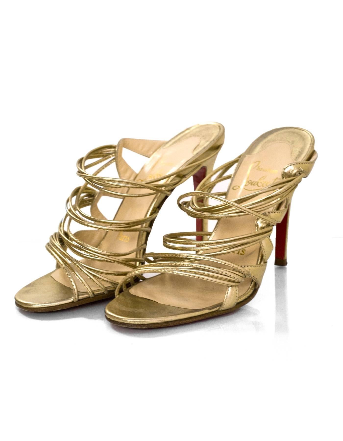 Christian Louboutin Gold Strappy Sandals Sz 35.5

Made In: Italy
Color: Gold
Materials: Leather
Closure/Opening: Slide-on
Sole Stamp: Christian Louboutin Made in Italy 35.5
Overall Condition: Excellent pre-owned condition with the exception of some