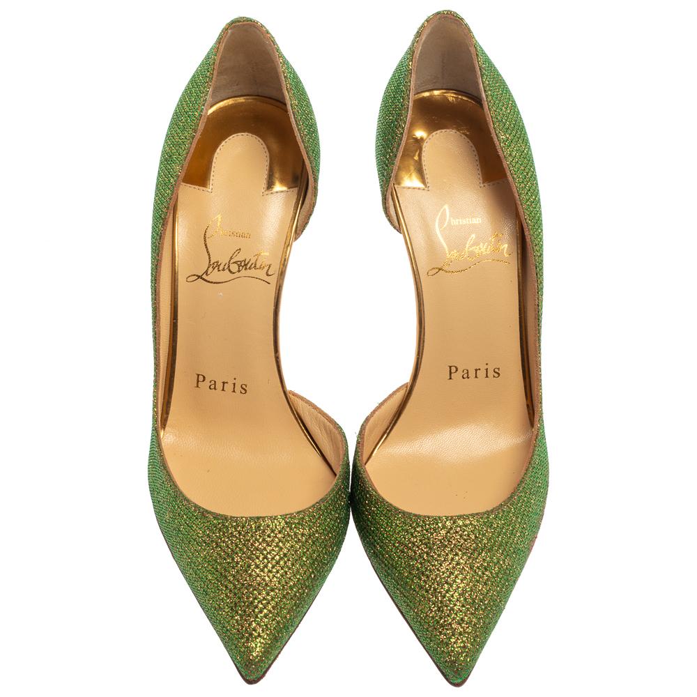Skilfully crafted from glitter fabric in a D'orsay style with pointed toes, these Christian Louboutin pumps come ready to give you a high-fashion experience. The rich green pumps with sharp-cut toplines, are balanced on 10.5 cm heels and finished