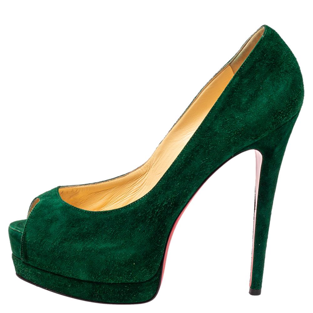 Stand out from a crowd with this gorgeous pair of Louboutins that exude high fashion with class! Crafted from suede, this is a creation from their Lady Peep collection. They feature a green shade with peep toes and a glossy exterior. Completed with