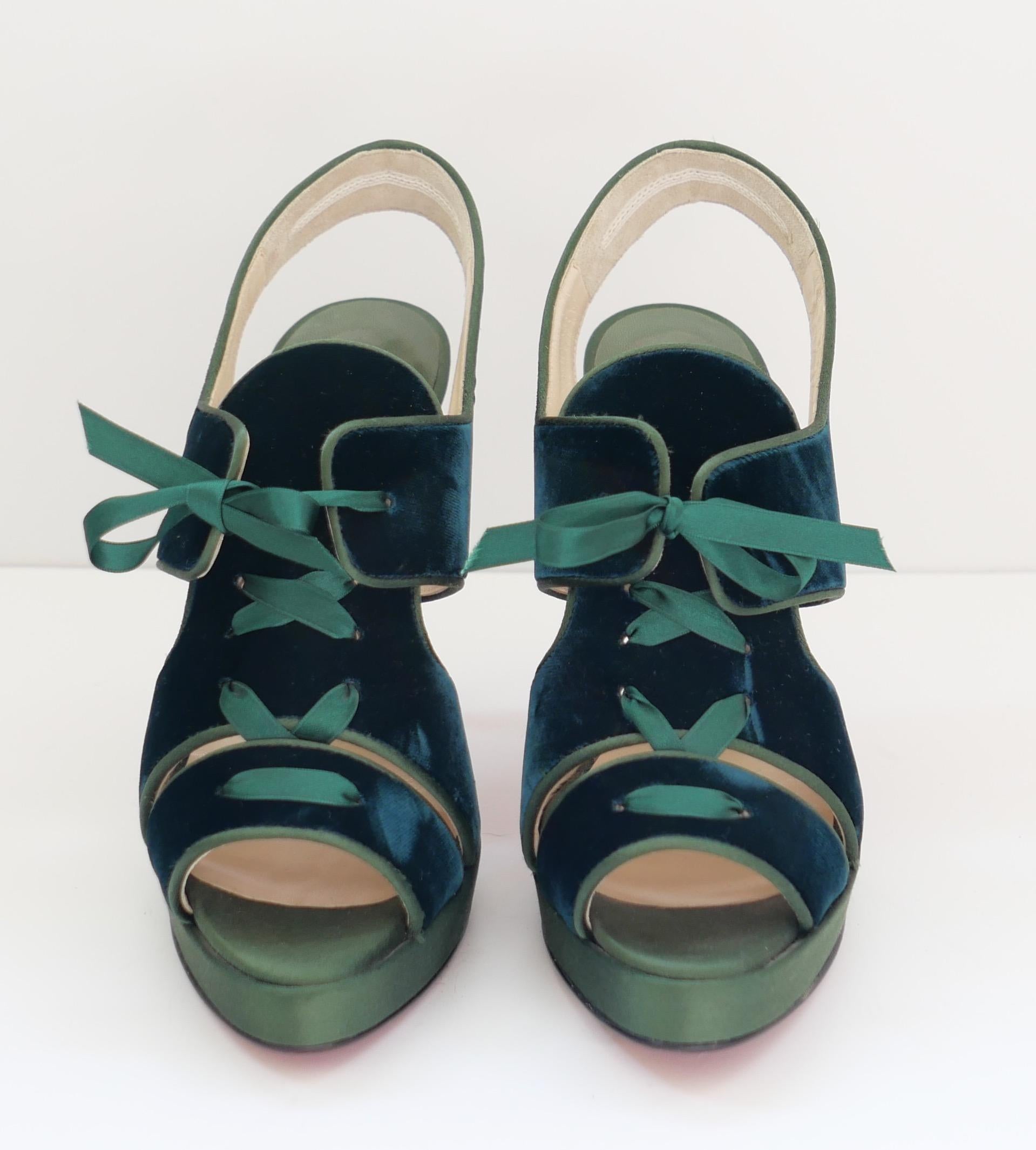 Gorgeous Christian Louboutin green velvet lace up platform sandals. Unworn with dustbag. Made from glossy dark green velvet and satin. to toes. They have lace up fronts, stiletto heels and signature red soles. Size 38.5. Measure approx - heel to toe