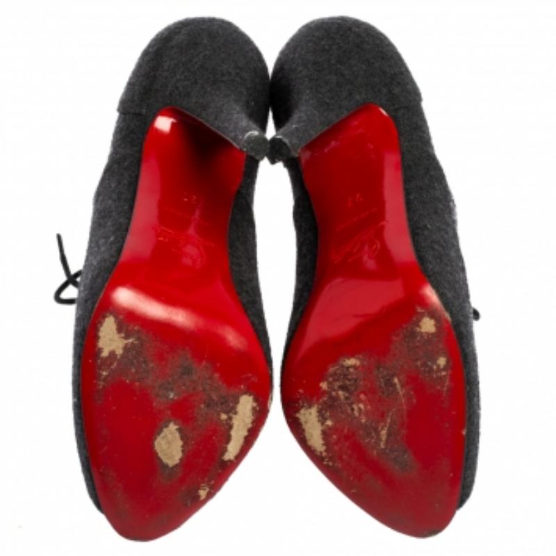 Christian Louboutin yet again brings a stunning set of booties that makes us marvel at its beauty and craftsmanship. They feature lace-ups at the vamps, peep toes, and 12.5 cm heels. The insoles are leather-lined.