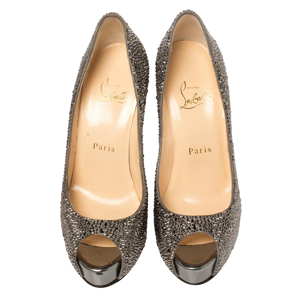 Stand out from a crowd with this gorgeous pair of Louboutins that exude high fashion with class! Crafted from leather, this is a creation from their Lady Peep collection. They feature a grey shade with peep toes and dazzling crystals embellished all