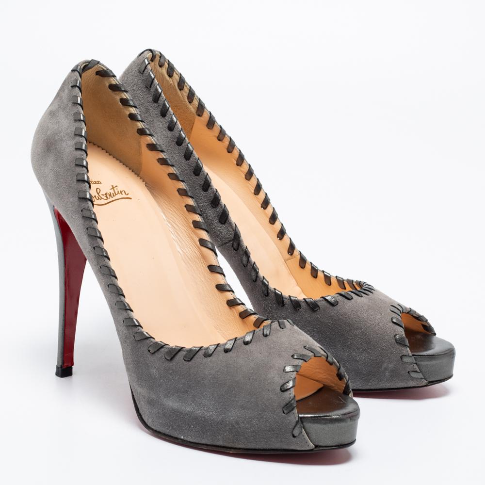 The whipstitch detailing beautifully outlines this pair of Christian Louboutin pumps. A timeless classic, it is created from grey suede, and it is perched upon 12.5cm heels. The signature red-lacquered soles of these shoes will reflect