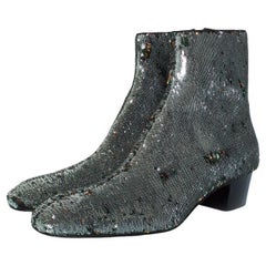 Christian Louboutin, Huston glitter boots in silver