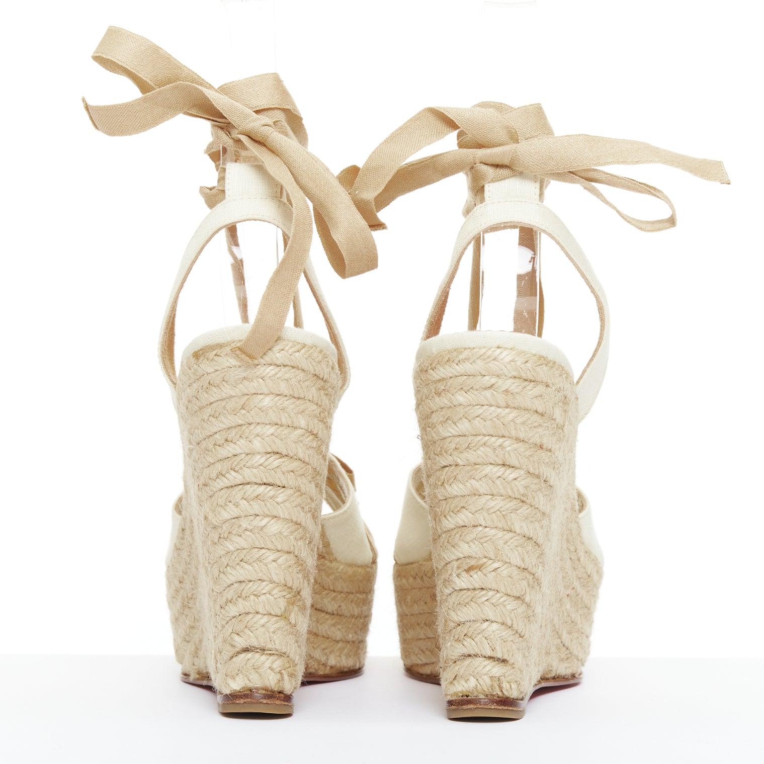 CHRISTIAN LOUBOUTIN Isabelle - Chaussures compensées à nœud papillon en toile de jute beige crème EU36 Pour femmes en vente