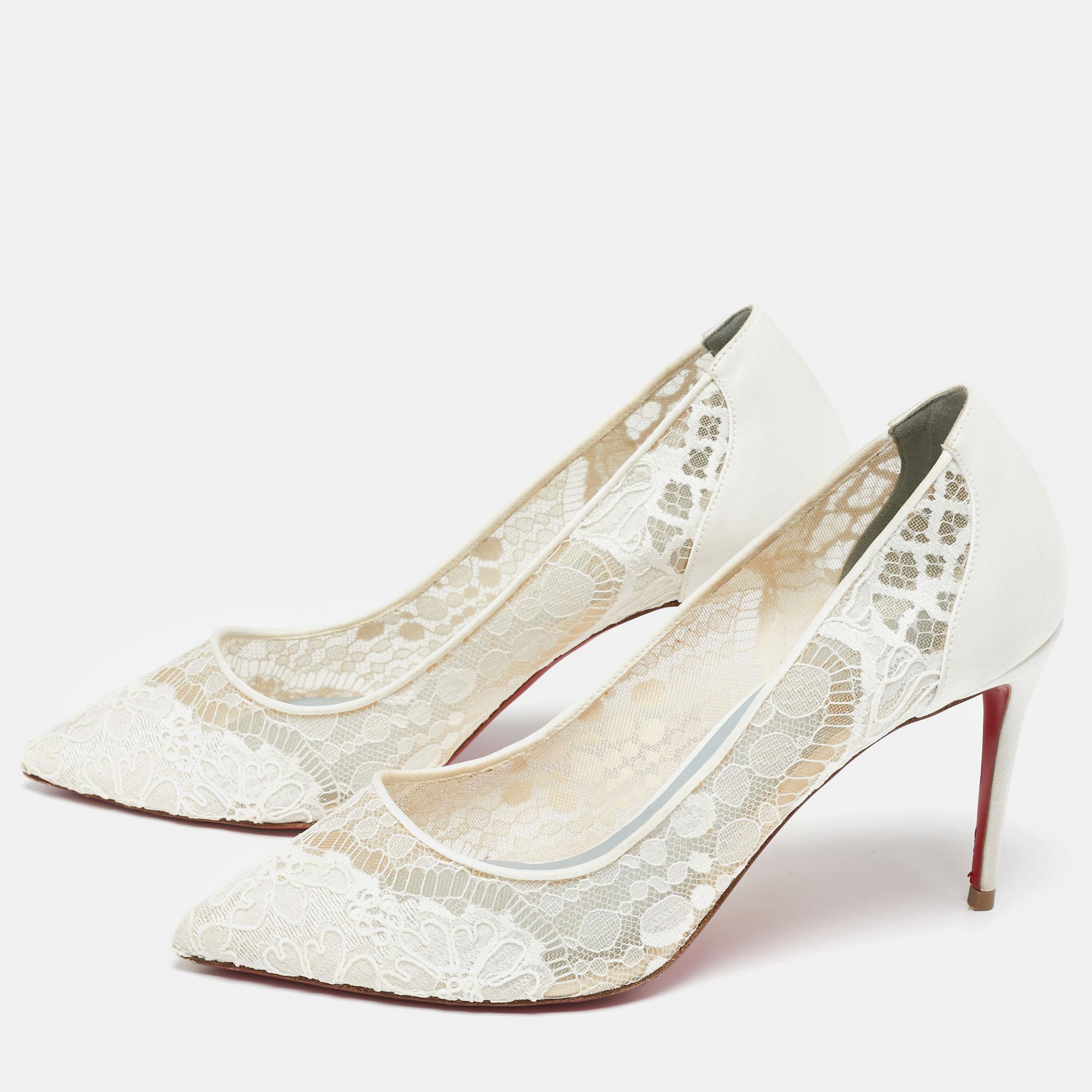 
Dazzle everyone with these pretty Louboutins by owning them today. Crafted from lace and satin, they carry a pointed toe design, sleek silhouette, and a glorious ivory-colored exterior. Completed with slender heels and signature red soles, this